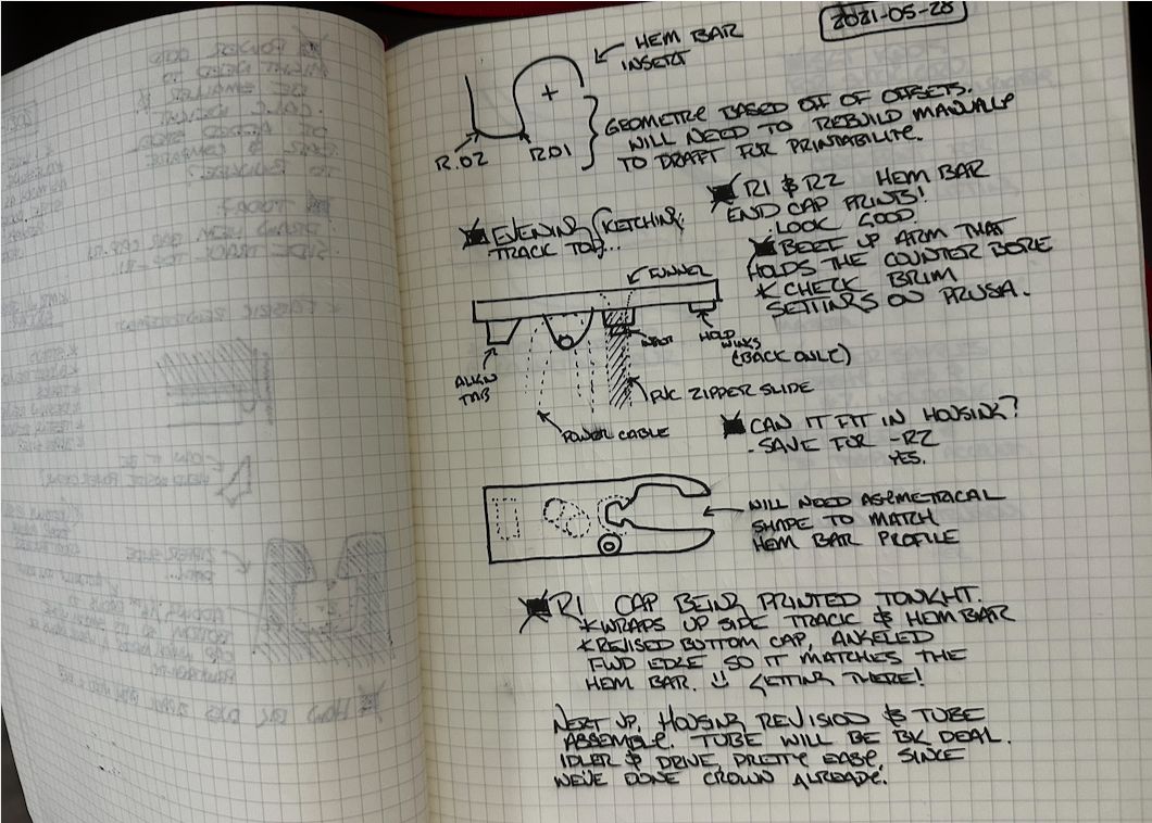 Engineering sketchbook with hand-drawn screen component details